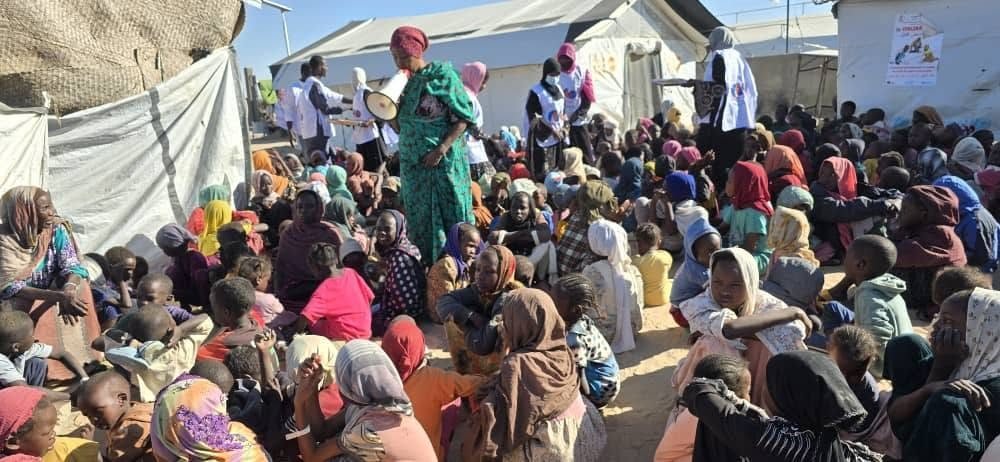 A woman leads an awareness session for displaced women and children in a camp in Tawila, 2026