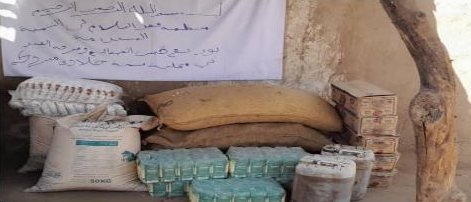 Sacks of flour, oil and boxed food ready for distribution in Sennar